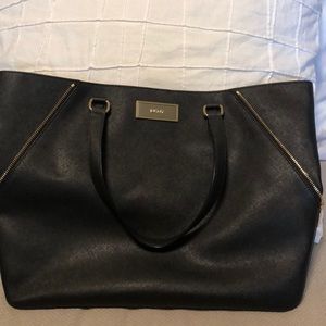 Large Black DKNY tote with bonus pouch.